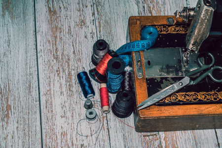 Sewing accessories sewing machine, colored threads, as well as scissors and measuring tape
