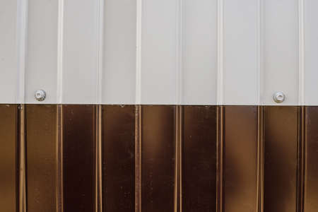 texture of white and brown metal siding closeの写真素材