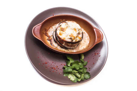 Baked Eggplant with Vegetables. Garnished with Fresh Greensの写真素材