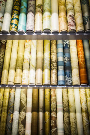 Rolls of different kinds of wallpaper close Three rowsの写真素材