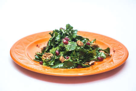 Delicious vegetable salad with rucola, pomegranate seeds, parmesan cheese and walnuts another viewの写真素材
