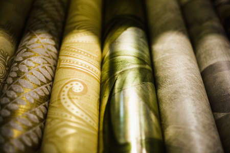 Rolls of different kinds of wallpaper close other viewの写真素材