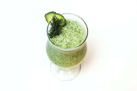 Fresh green healthy cucumber smoothie on a white backgroundの写真素材