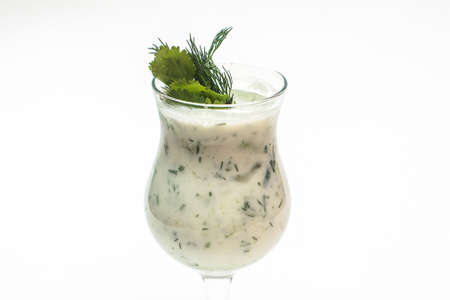 Fresh green healthy cucumber smoothie on a white background another viewの写真素材