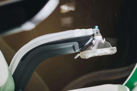 Mask for breathing oxygen lies on the armrest of the altitude chamberの写真素材