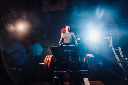 Man Using A Press Machine In A Fitness Clubの写真素材