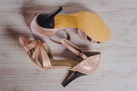 hand-made women's dance shoes made of genuine leather on the wooden surface macro photography. pink style closeの写真素材