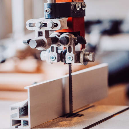 Electric fret saw for cutting wood. Toned image. stationary electric jigsaw close up viewの写真素材