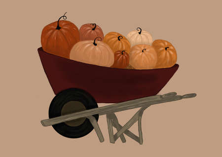 cart with pumpkins on 
beige backgroundの写真素材