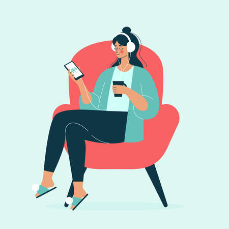 A young woman sits in a chair at home with a cup of tea and listens to a podcast with headphones, a woman listens to music, meditation. Vector illustration in a flat style.のイラスト素材