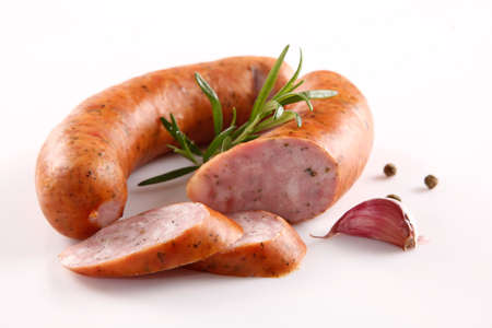 Tasty sausage with spices on whiteの写真素材