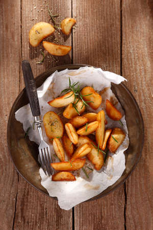 Baked potatoes with herbsの写真素材