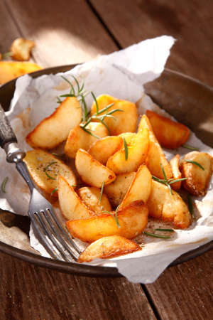 Baked potatoes with herbsの写真素材