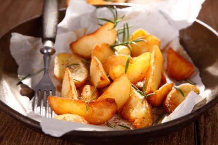 Baked potatoes with thymeの写真素材