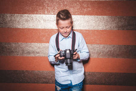 Boy photographer learning to take pictures, young photographerの写真素材