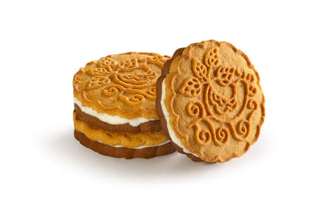 cookies with a layer of milk cream on a white backgroundの写真素材