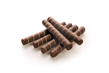 wafer rolls with chocolate filling on a white backgroundの写真素材