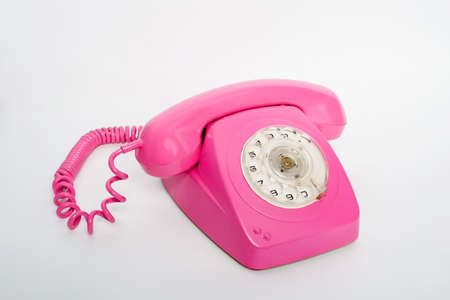 pink telephone on a white backgroundの写真素材