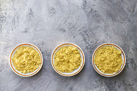 Mustard powder on a gray background.の写真素材