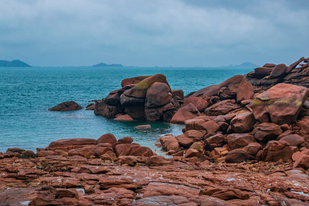 Pink granite rocks by the sea in northern Brittanyの写真素材