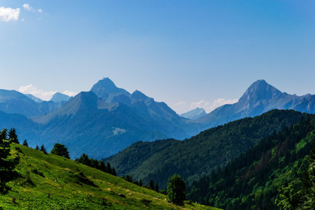 Mountain layers fading into blue haze in the Alpsの写真素材