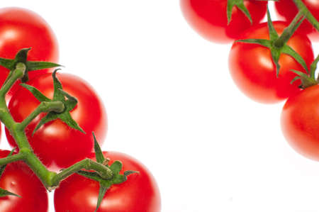 Cherry tomatoes isolated over white background close upの写真素材