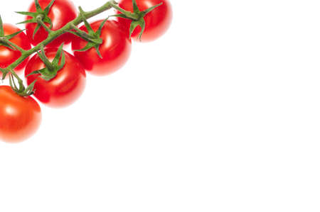Cherry tomatoes isolated over white background close upの写真素材