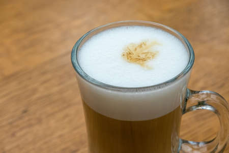 close up of white frothy foam in the cup of latte. Softness of drink. Breakfast time in cafeの写真素材