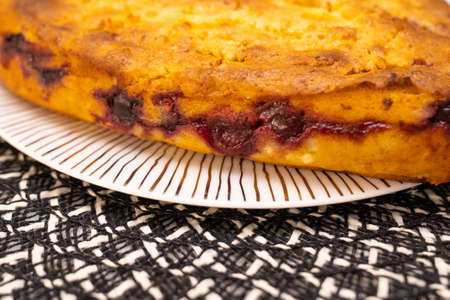 heart shaped homemade cherry pie on white plate on kitchen table. Bakery for loved onesの写真素材