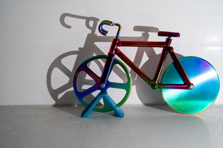 colorful bicycle and visible shadow, creative effect of sunlight, reflection on the wall, mirroring volume, healthy lifestyle, cardio exercise, fitness, children toy, sportの写真素材
