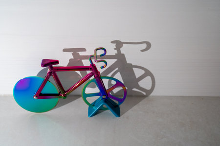 colorful bicycle and visible shadow, creative effect of sunlight, reflection on the wall, mirroring volume, healthy lifestyle, cardio exercise, fitness, children toy, sportの写真素材