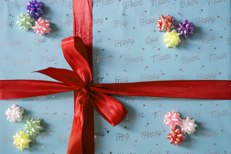 top view of colorful gift box with bright ribbon bow. Concept: holiday, celebration, birthday, New Year, Christmas, Valentines Day, Mothers Day, Thanksgiving, surpriseの写真素材