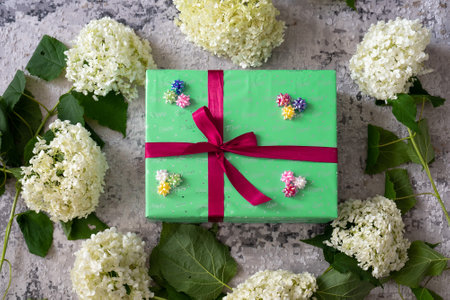 top view of colorful gift box with bright ribbon bow. Concept: holiday, celebration, birthday, New Year, Christmas, Valentines Day, Mothers Day, Thanksgiving, surpriseの写真素材