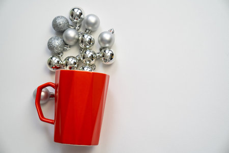 merry christmas and happy new year, festive red cup mug with silver sparkly baubles, imitation hot drink with steam, copy space, holiday celebrationの写真素材