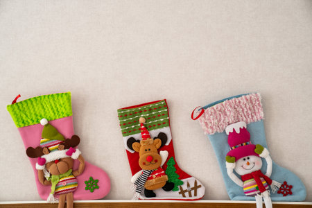reindeer christmas stockings, snowman chimney socks in bedroom, happy new year holidays, festive gift preparationの写真素材