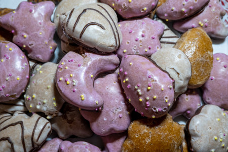 close up view of a variety of homemade gingerbread cookies, colored with sugar powderの写真素材