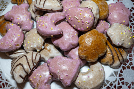 close up view of a variety of homemade gingerbread cookies, colored with sugar powderの写真素材