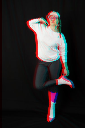 Stylish woman model posing on black background, rgb color split, abstract futuristic creative styleの写真素材
