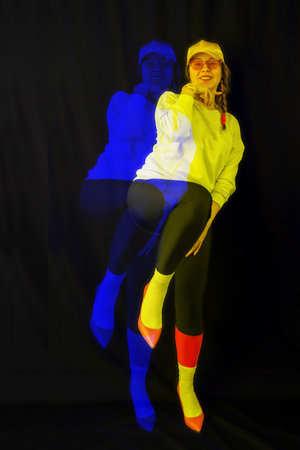 Stylish woman model posing on black background, rgb color split, abstract futuristic creative styleの写真素材