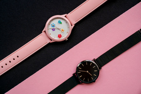 modern hand watches on black pink background, top view, flat lay of product, creative time expressionの写真素材