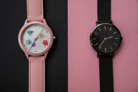 modern hand watches on black pink background, top view, flat lay of product, creative time expressionの写真素材