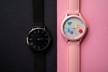 modern hand watches on black pink background, top view, flat lay of product, creative time expressionの写真素材