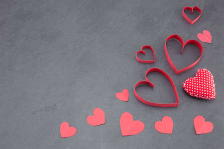 Assorted hearts on a slate background