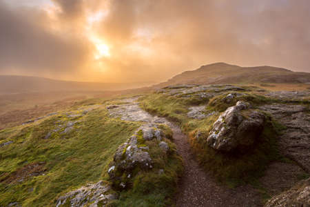 Stormy sunrise at saddle tor dartmoor devon uk