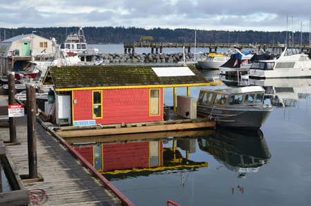 Marina with reflective calm waters on the east coast of Vancouver Island .のeditorial素材