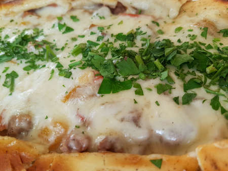 Traditional Turkish Cuisine Kasarli Pide boat-shaped flatbread with cheese, spices and herbs Food photographyの写真素材