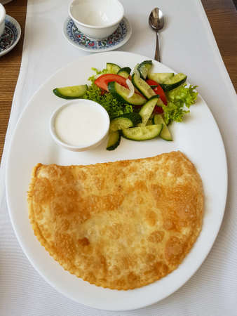 Crimean fried pasties with salad Food photographyの写真素材