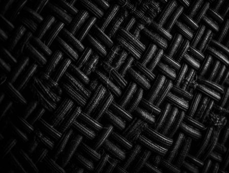 Dark black Abstract woven mat texture Wickerwork background created with Generative AI technologyの素材