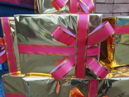 gift boxes with ribbons on the street, closeup of photo