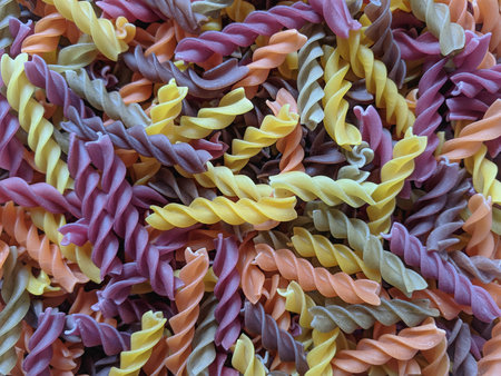 colorful fusilli pasta closeup for background, top viewの写真素材